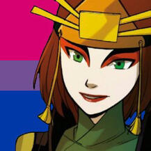 Suki smiling with the bi flag in the background.